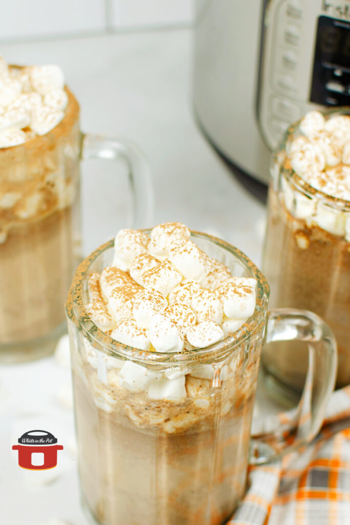 tuxedo hot chocolate in glass mug in front of an instant pot